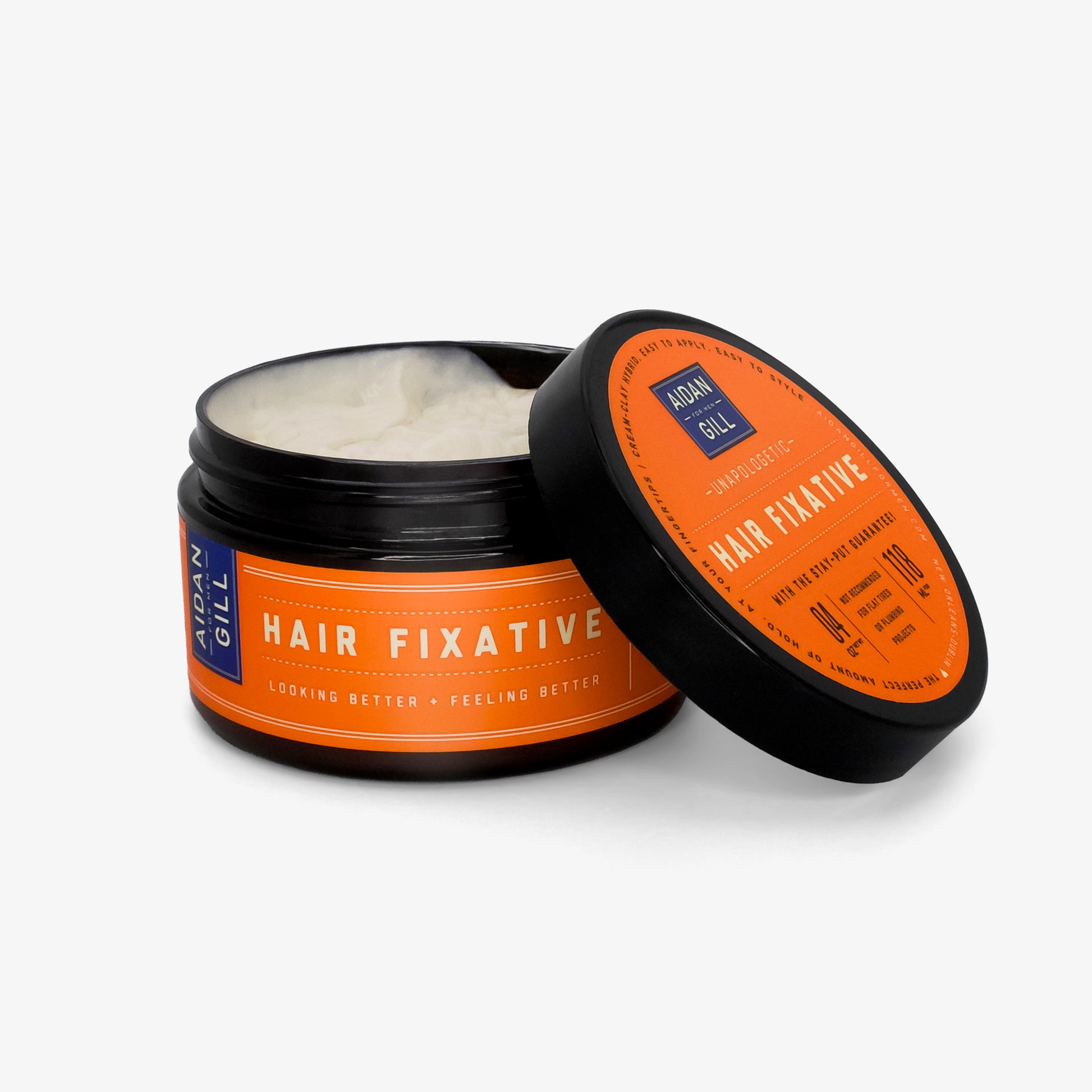 Open jar of Aidan Gill Hair Fixative on a white background