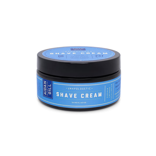 Jar of shave cream with blue label on a white background