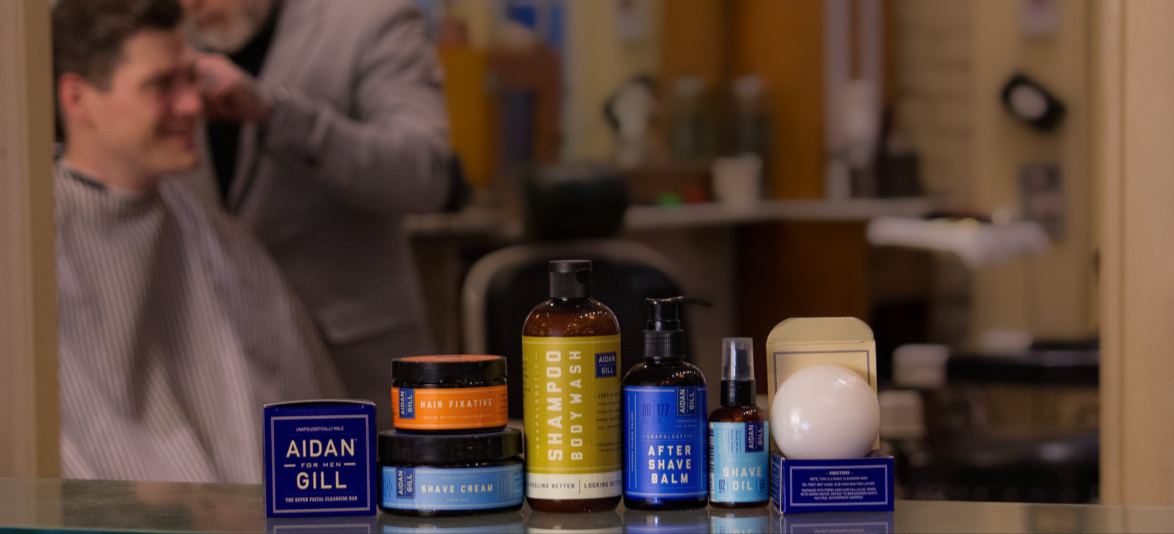Barber shop setting with grooming product line on a counter