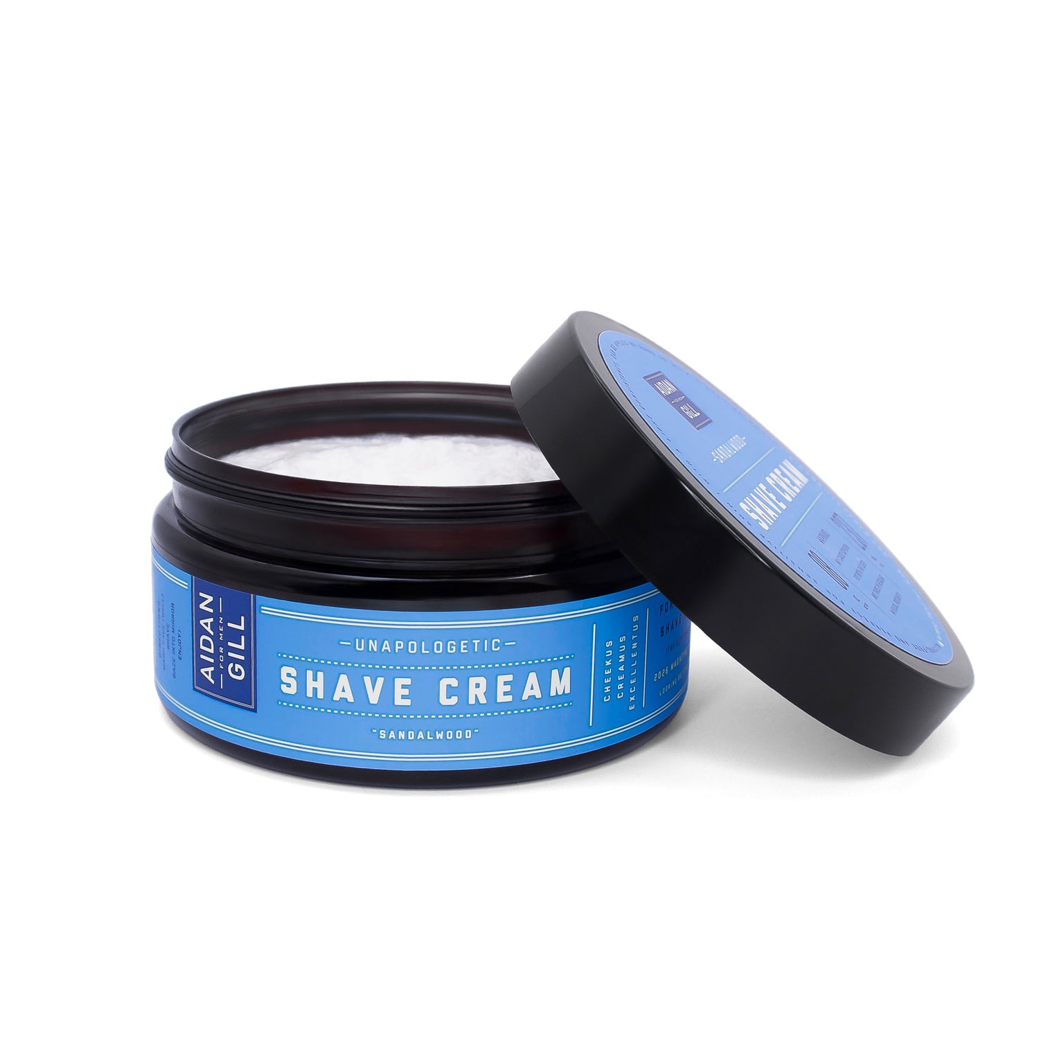 Aidan Gill shave cream with open jar. Jar has blue label and is on a white background.